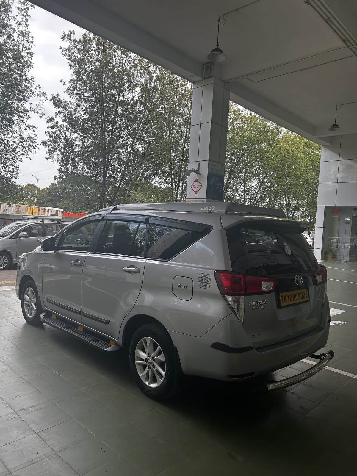 Innova Crysta taxi rear view — TN registered chauffeur-driven cab